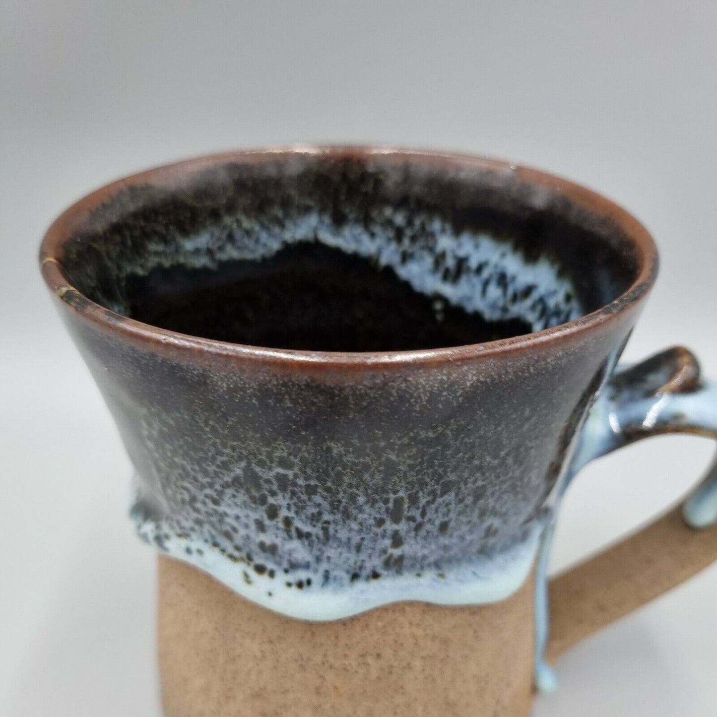 Pint Tankard Studio Pottery with heavy drip glaze. Makers mark to the base.