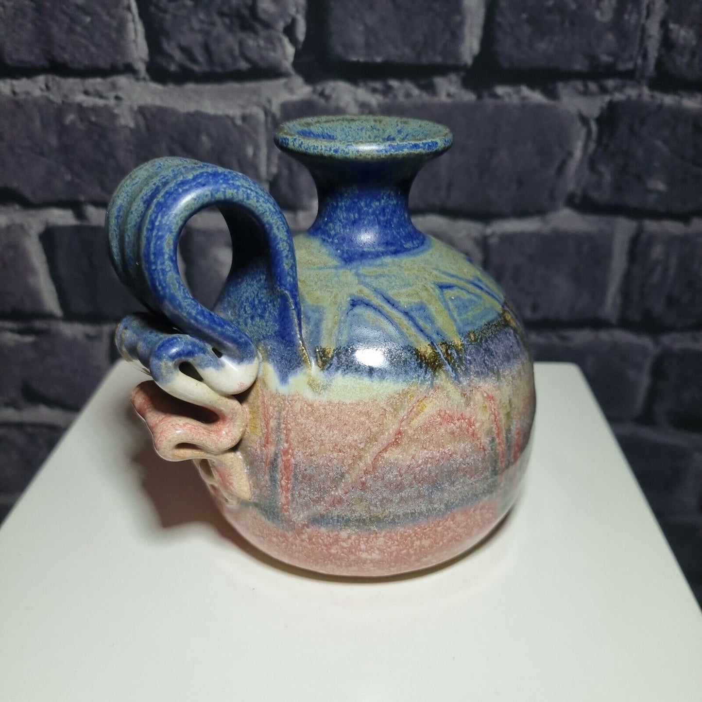 A Studio Pottery Vase with Scrolled Handle with unknown makers mark.