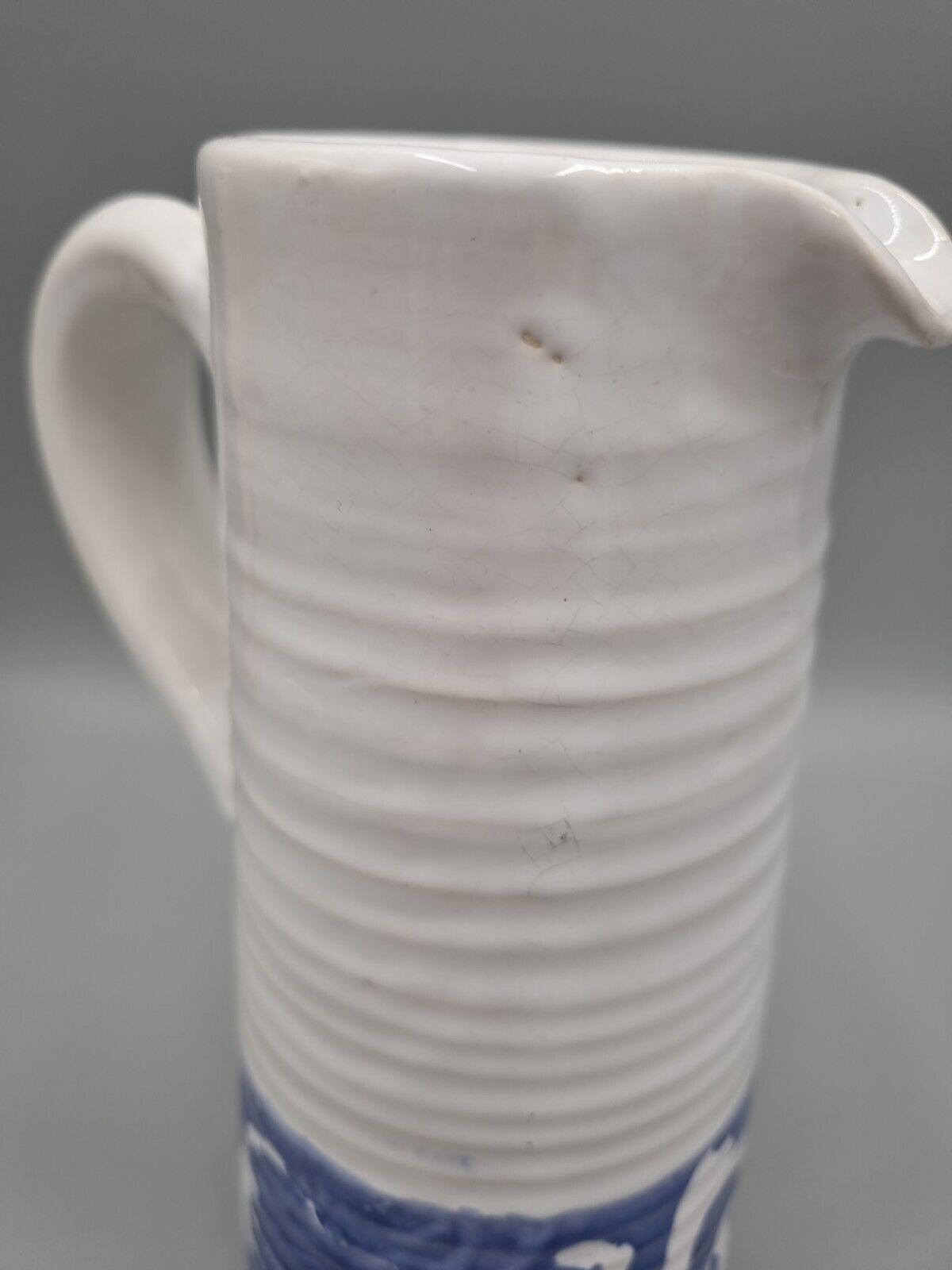 A Tall Studio Pottery Ribbed Jug / Pitcher, Unmarked.