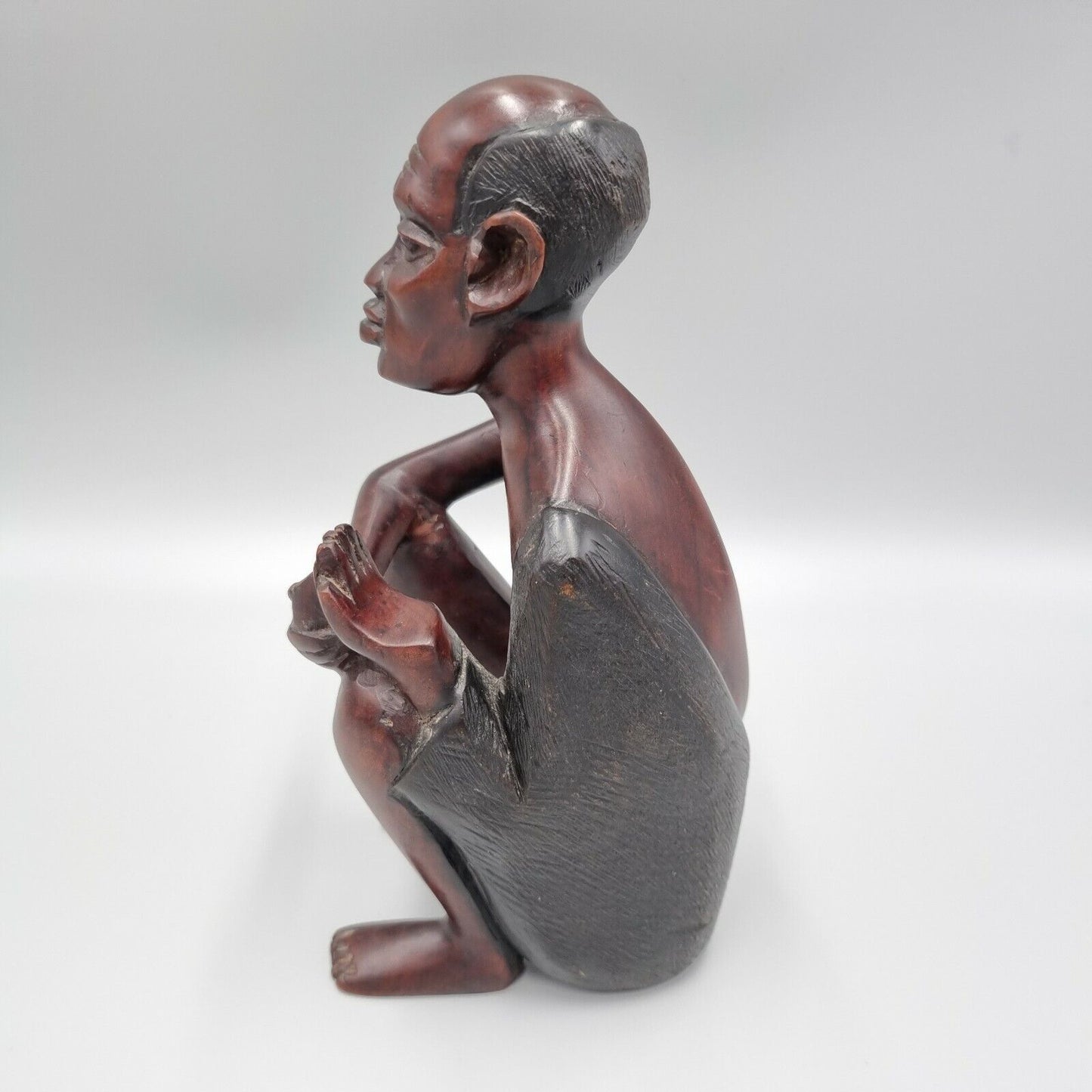 A Vintage Carved Dark Hard Wood African Seated Figure. VGC.