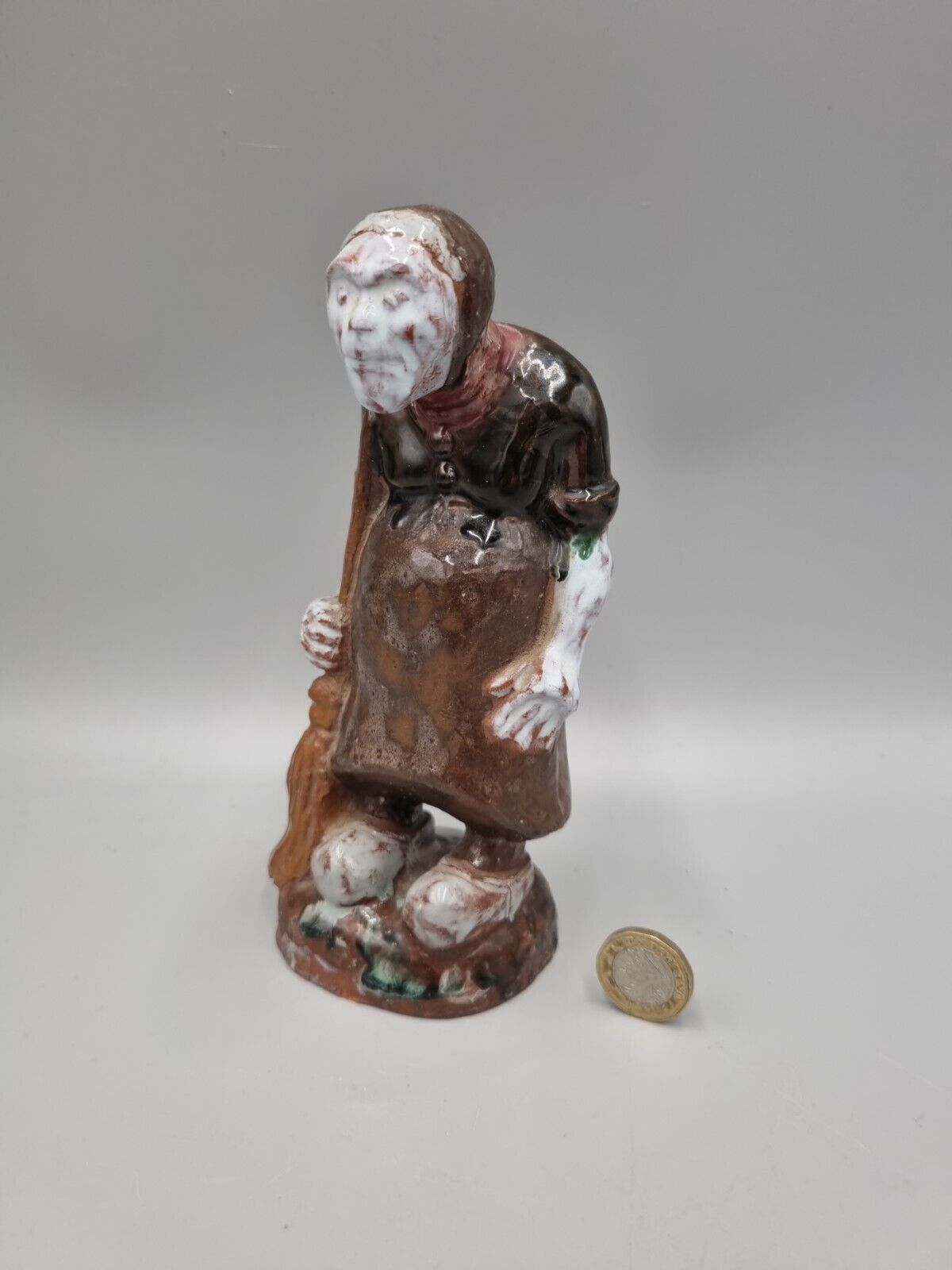 A Handmade Studio Pottery Figurine Of A Woman In Clogs, Fish markers Mark.