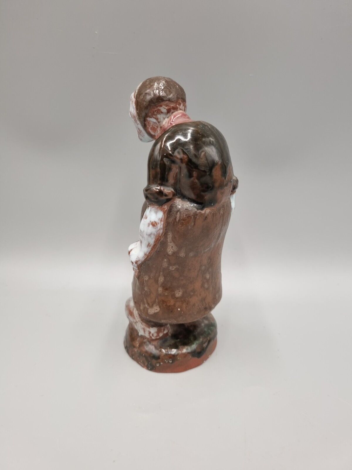 A Handmade Studio Pottery Figurine Of A Woman In Clogs, Fish markers Mark.