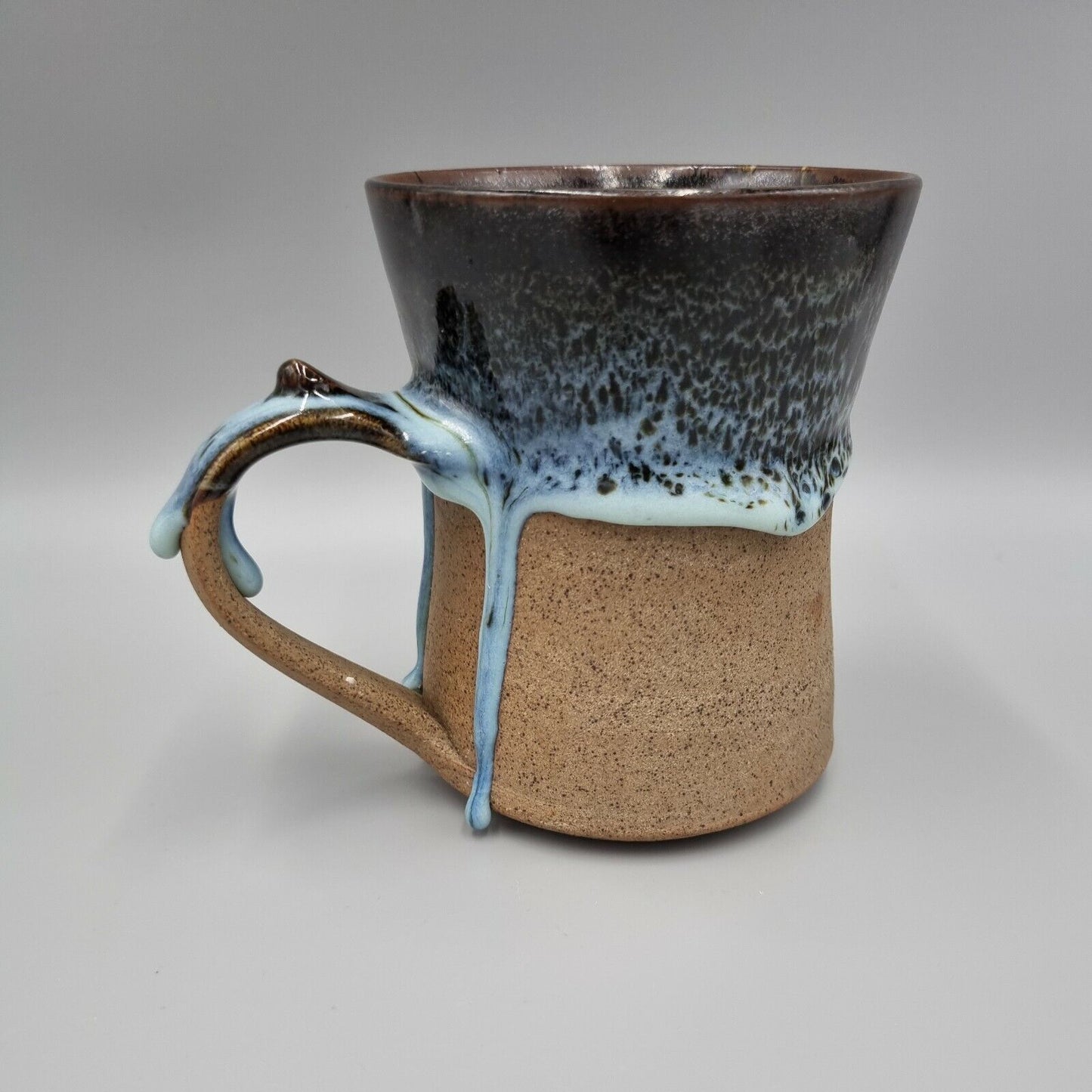 Pint Tankard Studio Pottery with heavy drip glaze. Makers mark to the base.