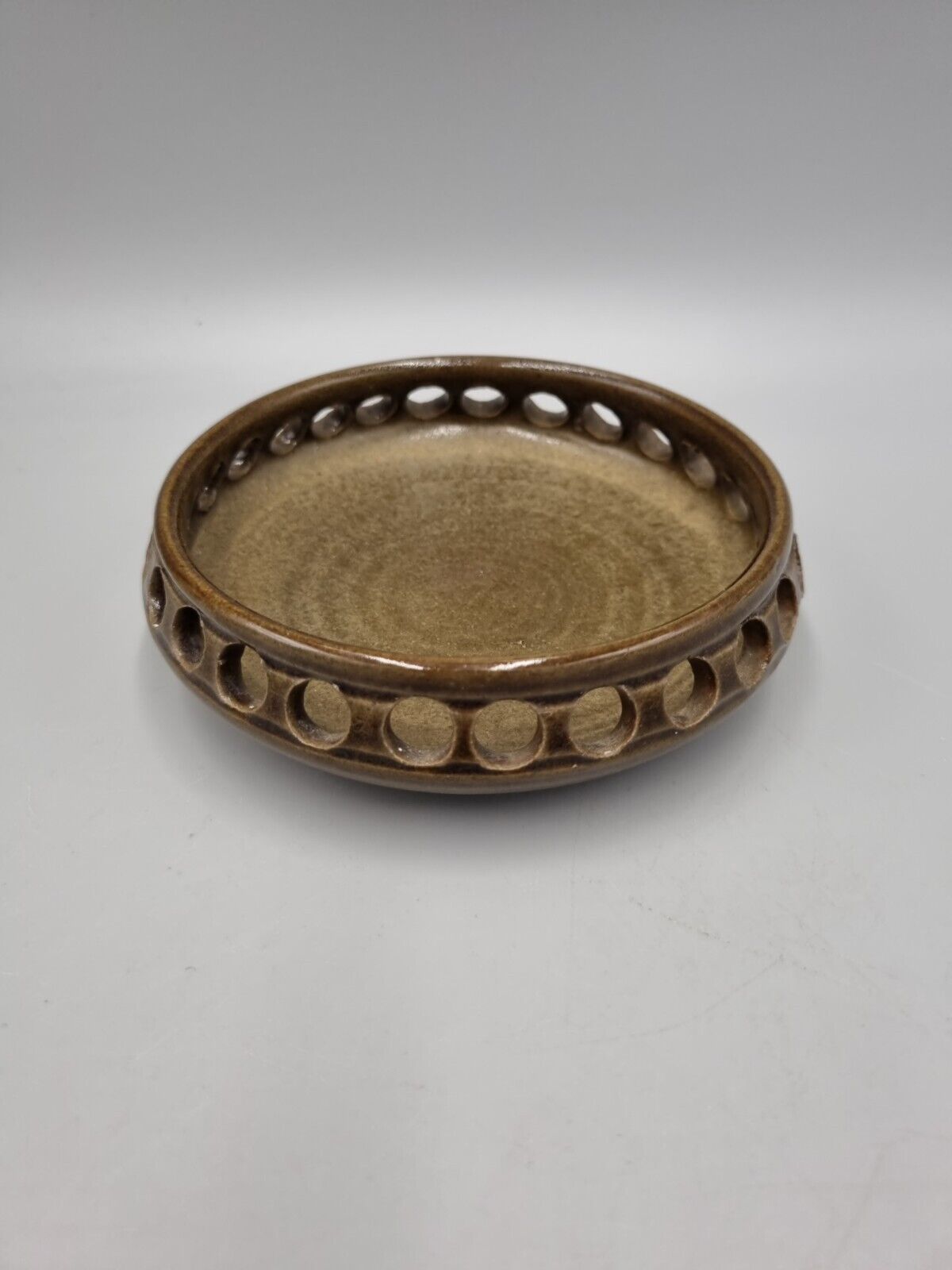 A  Studio Pottery Pierced Shallow Bowl, Impressed Flower Mark.