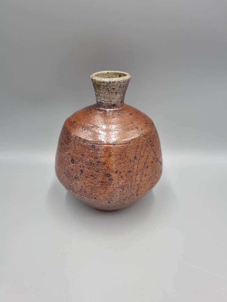 A William Marshall for Leach Pottery Bottle Vase With Iron Glaze And Incised Decoration.