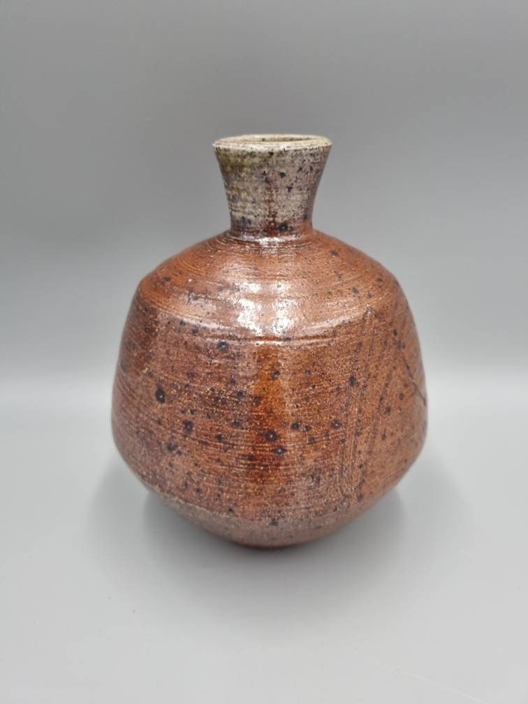 A William Marshall for Leach Pottery Bottle Vase With Iron Glaze And Incised Decoration.