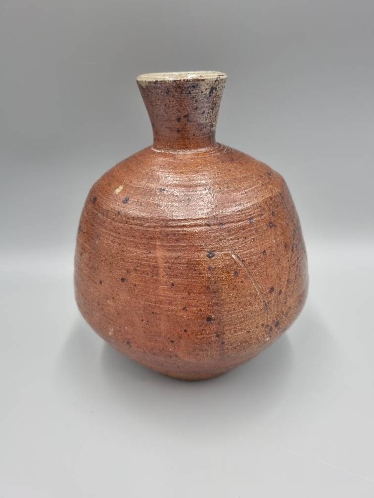 A William Marshall for Leach Pottery Bottle Vase With Iron Glaze And Incised Decoration.